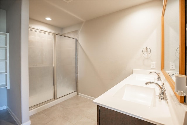 3518 Windham Way, Katy, TX 77494 - bathroom with double vanity, tiled shower, tile patterned flooring, baseboards, and recessed lighting