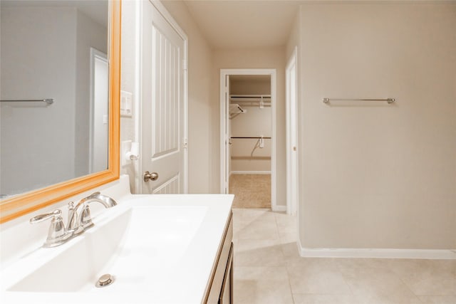 3518 Windham Way, Katy, TX 77494 - bathroom with vanity, baseboards, tile patterned floors, and a spacious closet