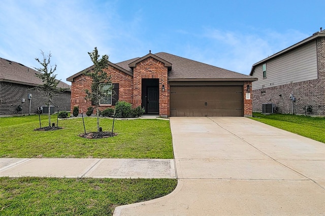 3518 Windham Way, Katy, TX 77494 - view of front of house featuring brick siding, a front lawn, a garage, a shingled roof, and driveway