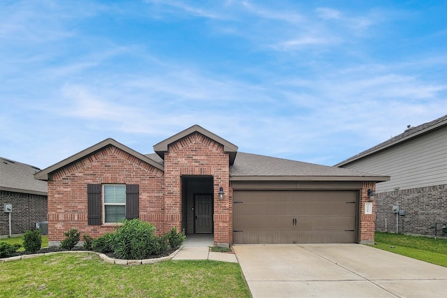 3518 Windham Way, Katy, TX 77494 - single story home featuring brick siding, a garage, driveway, and a front lawn