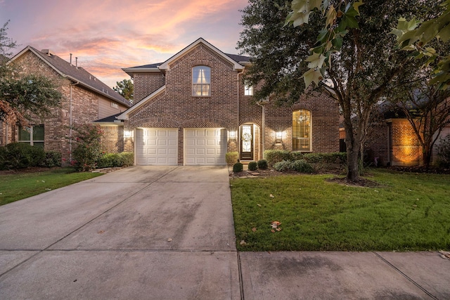 8442 Horsepen Bend Dr, Conroe, TX 77385 - traditional-style home with brick siding, concrete driveway, and a front yard
