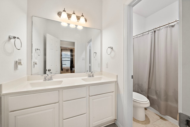 8442 Horsepen Bend Dr, Conroe, TX 77385 - full bathroom featuring toilet, double vanity, and tile patterned flooring