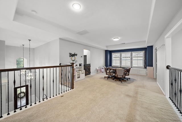 8442 Horsepen Bend Dr, Conroe, TX 77385 - interior space featuring a raised ceiling, carpet flooring, and arched walkways