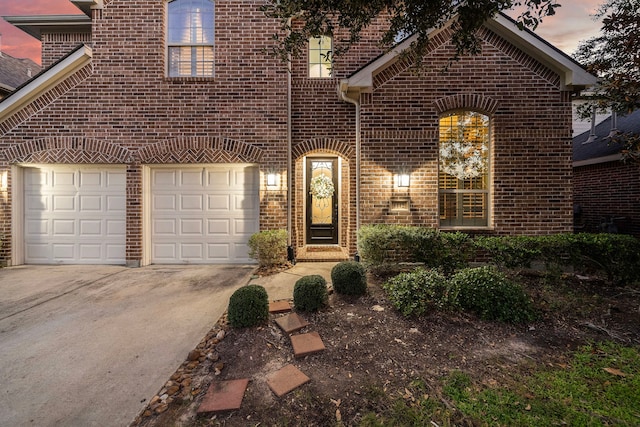 8442 Horsepen Bend Dr, Conroe, TX 77385 - view of front of house featuring brick siding, driveway, and a garage