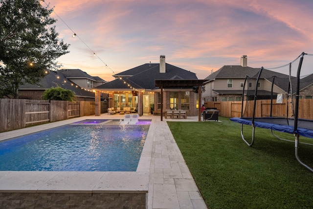 8442 Horsepen Bend Dr, Conroe, TX 77385 - view of pool with a trampoline, outdoor lounge area, a patio area, and a pergola