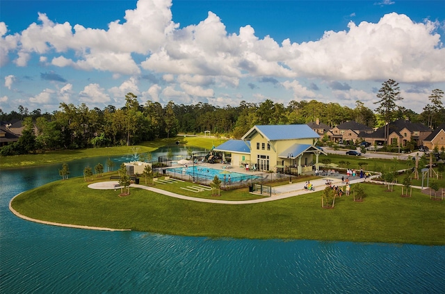 8442 Horsepen Bend Dr, Conroe, TX 77385 - view of home's community with a patio, a pool, a yard, and a water view