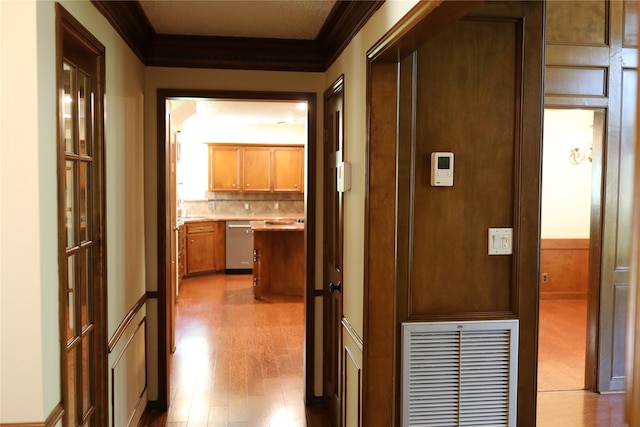 3003 Roseheath Ln, Houston, TX 77073 - corridor featuring crown molding and wood finished floors