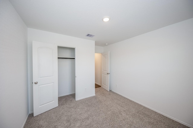 5126 Ternberry Forest Ln, Katy, TX 77449 - unfurnished bedroom featuring light carpet, a closet, and baseboards