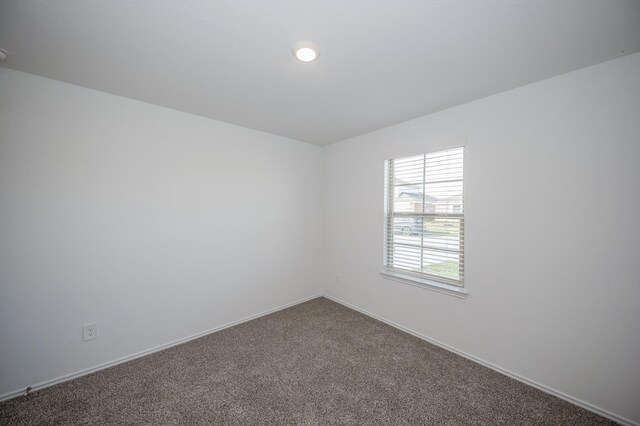 5126 Ternberry Forest Ln, Katy, TX 77449 - empty room featuring dark colored carpet and baseboards