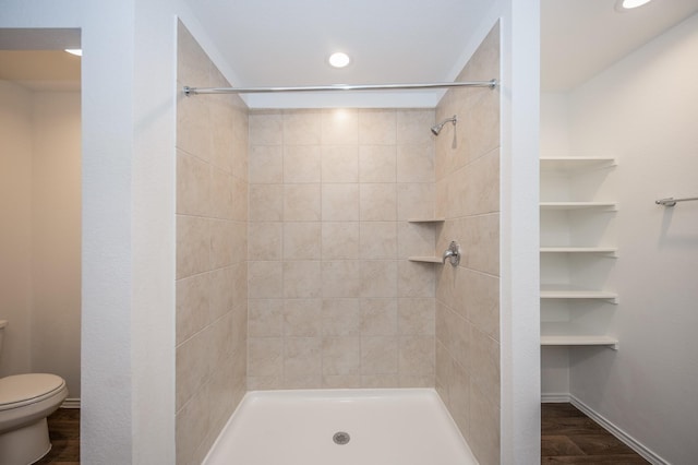 5126 Ternberry Forest Ln, Katy, TX 77449 - bathroom with toilet, tiled shower, recessed lighting, wood finished floors, and baseboards