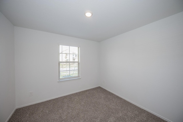 5126 Ternberry Forest Ln, Katy, TX 77449 - spare room featuring dark carpet, baseboards, and recessed lighting