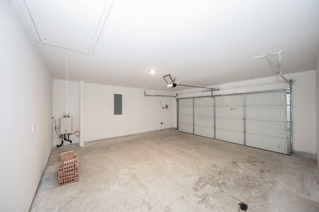5126 Ternberry Forest Ln, Katy, TX 77449 - garage with electric panel, a garage door opener, and tankless water heater