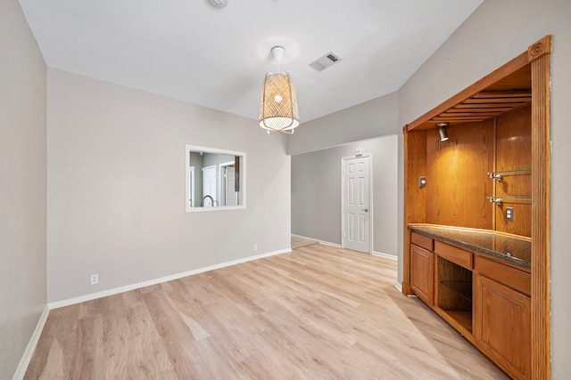 2444 Bering Dr Unit 2444, Houston, TX 77057 - unfurnished living room featuring light wood finished floors and baseboards