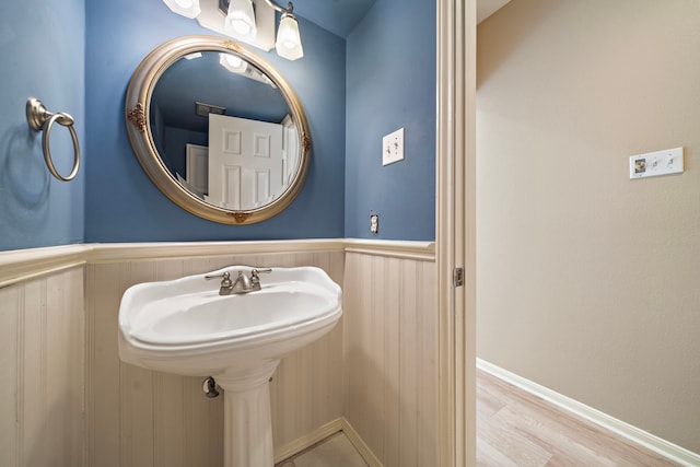 2444 Bering Dr Unit 2444, Houston, TX 77057 - bathroom with wood finished floors and a wainscoted wall