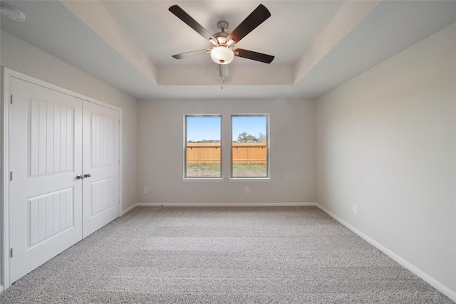 805 Clear Valley Ln, Dayton, TX 77535 - unfurnished bedroom featuring carpet flooring, a raised ceiling, a closet, and baseboards