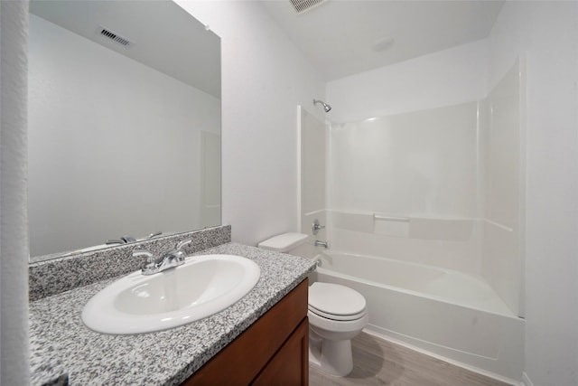 805 Clear Valley Ln, Dayton, TX 77535 - full bathroom with toilet, vanity, shower / tub combination, and wood finished floors