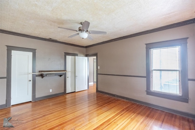 1166 Ross Ave, Abilene, TX 79605 - unfurnished room with light wood-style flooring, crown molding, a ceiling fan, and baseboards