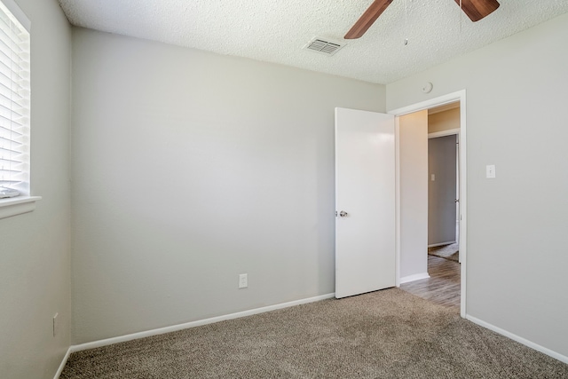 5606 Cypressgate Dr, Spring, TX 77373 - carpeted empty room with a ceiling fan, baseboards, a textured ceiling, and a smoke detector