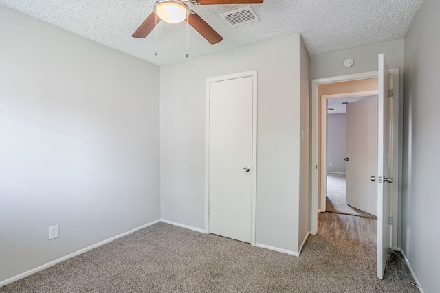 5606 Cypressgate Dr, Spring, TX 77373 - unfurnished bedroom with carpet floors, baseboards, a textured ceiling, and ceiling fan