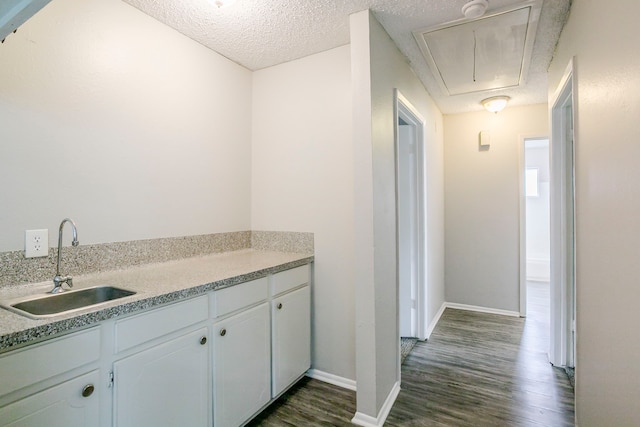 5606 Cypressgate Dr, Spring, TX 77373 - kitchen with a sink, dark wood finished floors, light countertops, baseboards, and a textured ceiling
