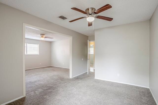 5606 Cypressgate Dr, Spring, TX 77373 - unfurnished room with carpet, a ceiling fan, baseboards, and a textured ceiling