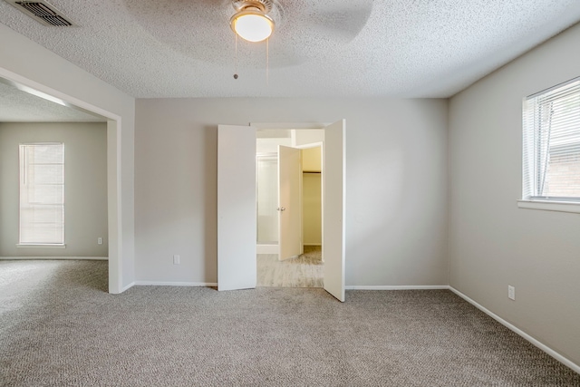 5606 Cypressgate Dr, Spring, TX 77373 - unfurnished room featuring carpet flooring, a textured ceiling, ceiling fan, and baseboards