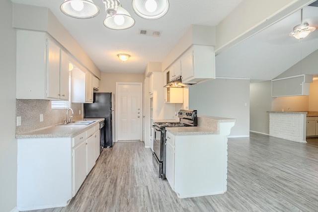5606 Cypressgate Dr, Spring, TX 77373 - kitchen with gas range, a sink, light wood-type flooring, and light countertops