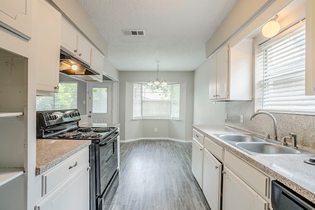 5606 Cypressgate Dr, Spring, TX 77373 - kitchen featuring black electric range oven, a sink, stainless steel dishwasher, white cabinets, and baseboards