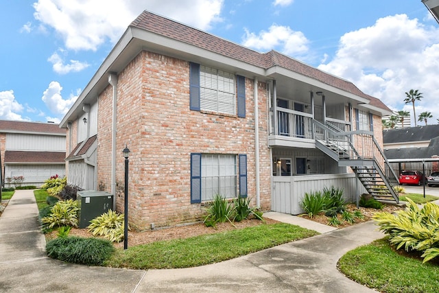 2350 Bering Dr Unit 105, Houston, TX 77057 - view of building exterior featuring stairway and cooling unit