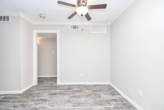2350 Bering Dr Unit 105, Houston, TX 77057 - spare room featuring ornamental molding, a ceiling fan, a smoke detector, wood finished floors, and baseboards