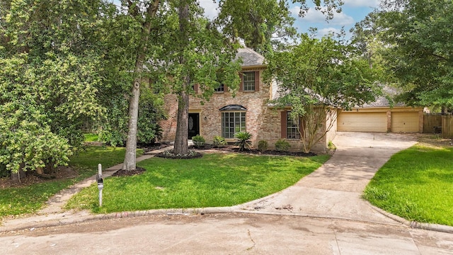 1003 Romaine Ln, Houston, TX 77090 - view of front of property with driveway, a front yard, brick siding, and a garage