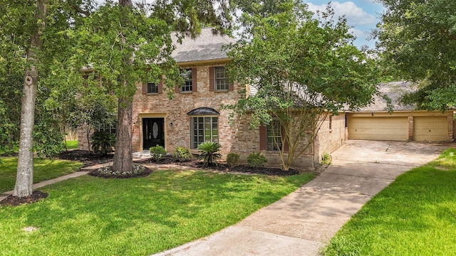 1003 Romaine Ln, Houston, TX 77090 - view of front of house featuring brick siding, concrete driveway, a front yard, and a garage