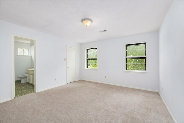 1003 Romaine Ln, Houston, TX 77090 - spare room with light carpet, healthy amount of natural light, and baseboards