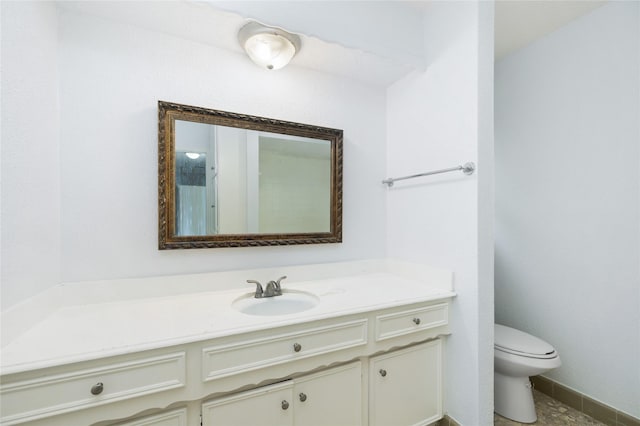 1003 Romaine Ln, Houston, TX 77090 - bathroom featuring vanity, toilet, and baseboards