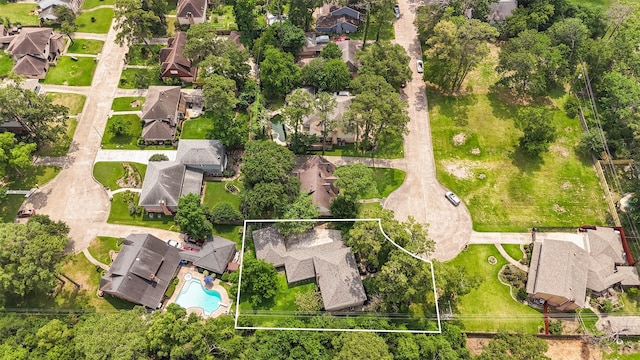 1003 Romaine Ln, Houston, TX 77090 - aerial perspective of suburban area with property parcel outlined and a pool