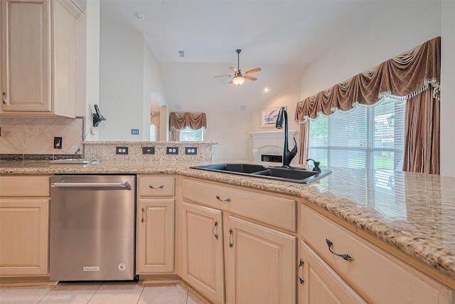 14202 Valley Bend Ct, Sugar Land, TX 77498 - kitchen featuring dishwasher, ceiling fan, a fireplace, tasteful backsplash, and a sink