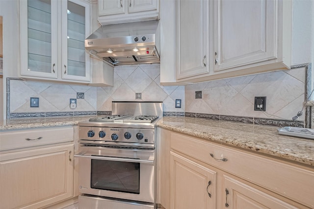 14202 Valley Bend Ct, Sugar Land, TX 77498 - kitchen featuring stainless steel range, island exhaust hood, tasteful backsplash, and light stone countertops