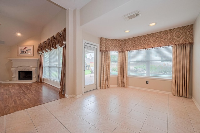14202 Valley Bend Ct, Sugar Land, TX 77498 - unfurnished living room featuring a premium fireplace, light tile patterned floors, baseboards, and recessed lighting