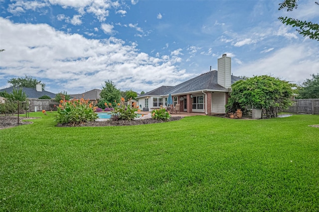 14202 Valley Bend Ct, Sugar Land, TX 77498 - rear view of property featuring brick siding, a patio, and a chimney