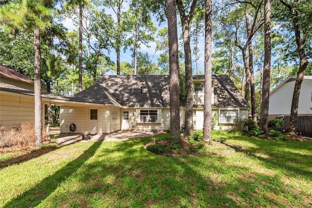 6211 Darby Way, Spring, TX 77389 - rear view of house with a patio area and a yard