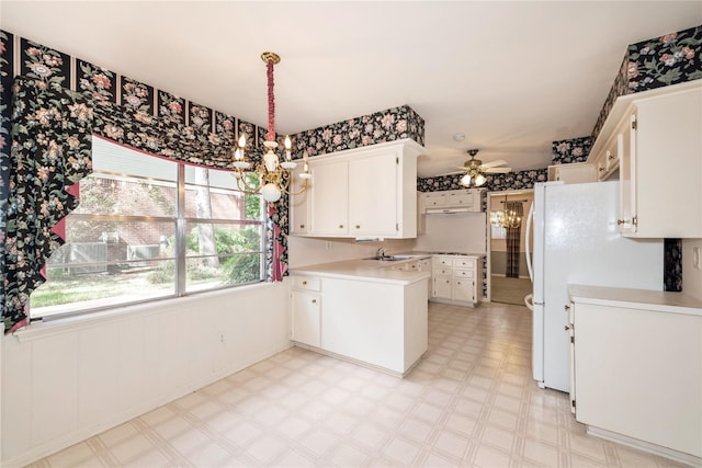 6211 Darby Way, Spring, TX 77389 - kitchen with a chandelier, light flooring, a peninsula, and light countertops