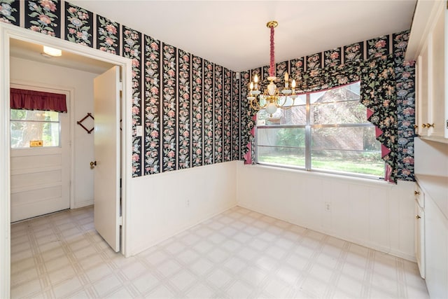 6211 Darby Way, Spring, TX 77389 - unfurnished dining area featuring a chandelier, wallpapered walls, wainscoting, tile patterned floors, and plenty of natural light