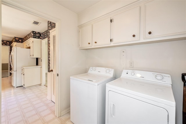 6211 Darby Way, Spring, TX 77389 - laundry area with independent washer and dryer, light floors, cabinet space, and baseboards