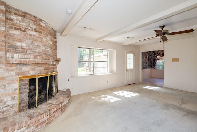 6211 Darby Way, Spring, TX 77389 - unfurnished living room featuring a fireplace, beamed ceiling, carpet floors, and a ceiling fan
