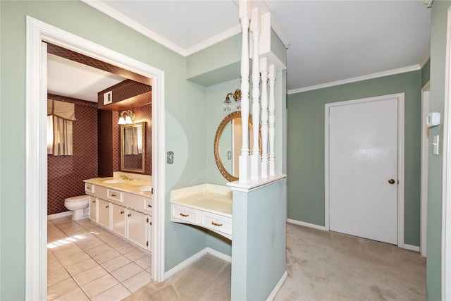 6211 Darby Way, Spring, TX 77389 - bathroom featuring toilet, vanity, crown molding, tile patterned floors, and baseboards