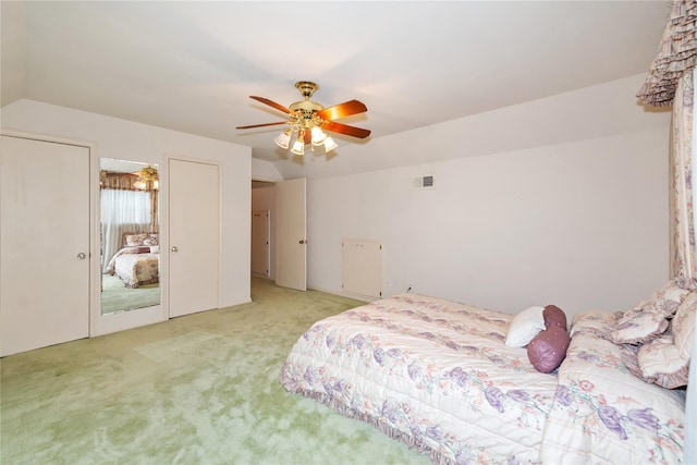 6211 Darby Way, Spring, TX 77389 - bedroom featuring light carpet, two closets, a ceiling fan, and vaulted ceiling