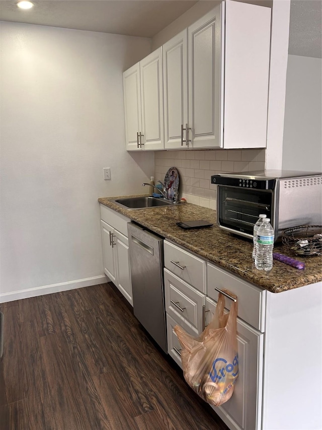 3400 Timmons Ln Unit 30, Houston, TX 77027 - kitchen featuring dishwasher, a sink, white cabinets, and baseboards