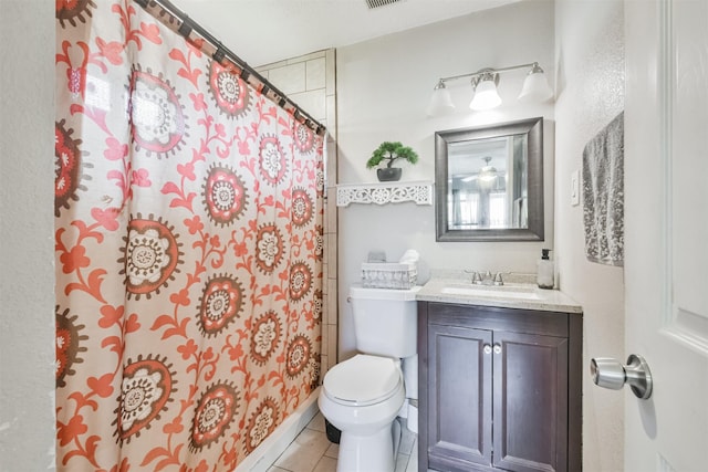 1115 Turner St, Baytown, TX 77520 - bathroom with toilet, vanity, tile patterned floors, and a shower with curtain