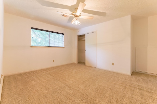 518 Lorie Ln, Pasadena, TX 77586 - unfurnished bedroom featuring light carpet, a closet, a ceiling fan, and baseboards