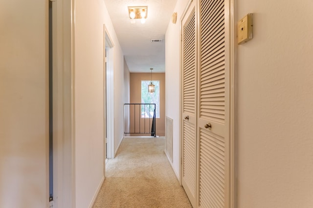 518 Lorie Ln, Pasadena, TX 77586 - hall featuring light colored carpet, an upstairs landing, and baseboards